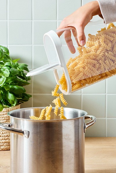 Pouring pasta to pot from SmartStore Flip dry food keeper